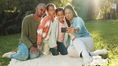 Happy-family,-selfie-and-picnic-blanket-at-park-to