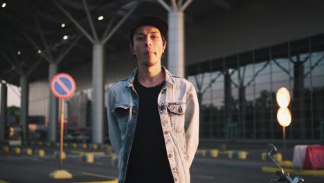 cinematic portrait of young hipster man on urban background