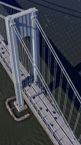 verrazano narrows bridge with passing cars and trucks