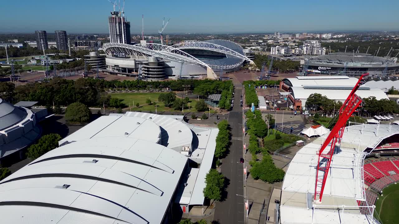 Drone aerial shot of Accor stadium buildings road street show ground super dome venue concert football sports arena live music Sydney Olympic Park Homebush NSW Australia tourism 4K