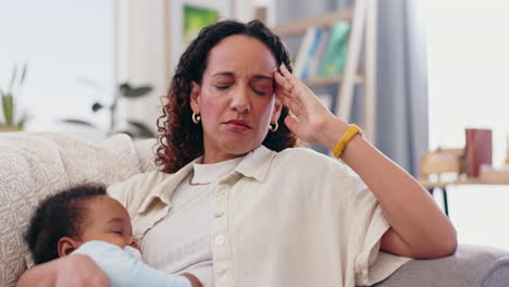stressed mother with sleeping baby