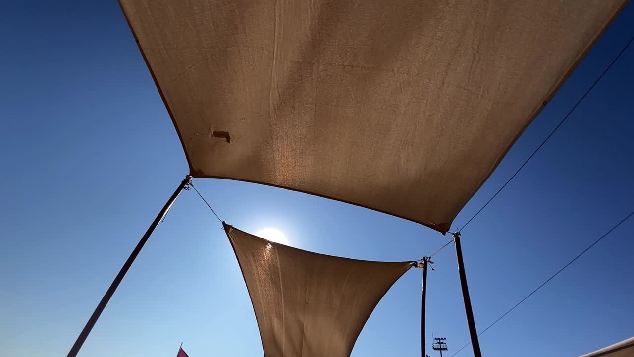 Sunshade canopy against a blue sky