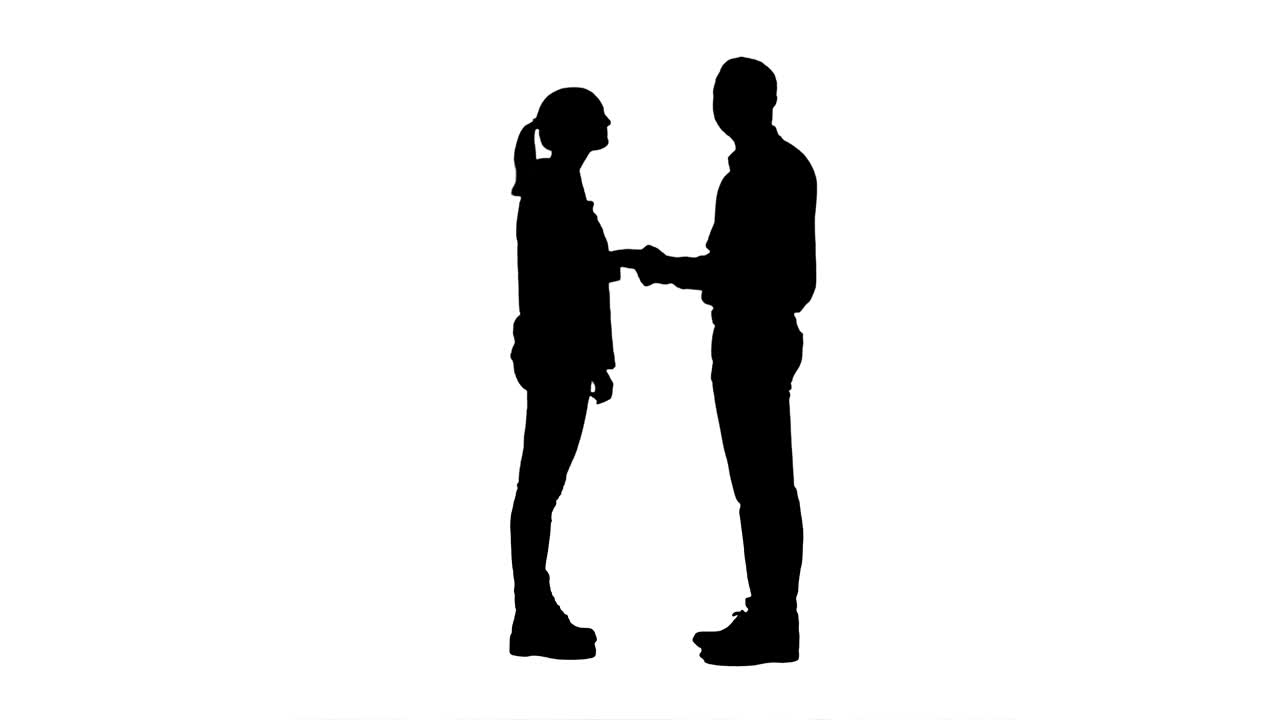 실루 두 젊은이가 손을 흔들고 카메라를 쳐다보고 엄지손가락을 들어 올립니다.