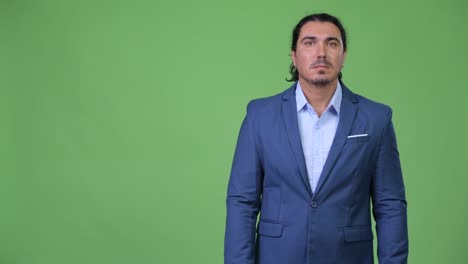 handsome businessman showing something