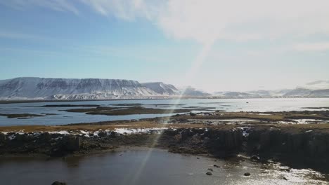iceland lake aerial dolly-in with sun glare
