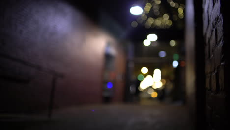 night alleyway with bokeh lights and a person