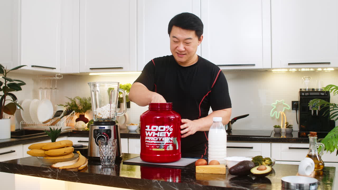 Asian man adding whey protein to blender with banana and cottage cheese preparing healthy diet shake