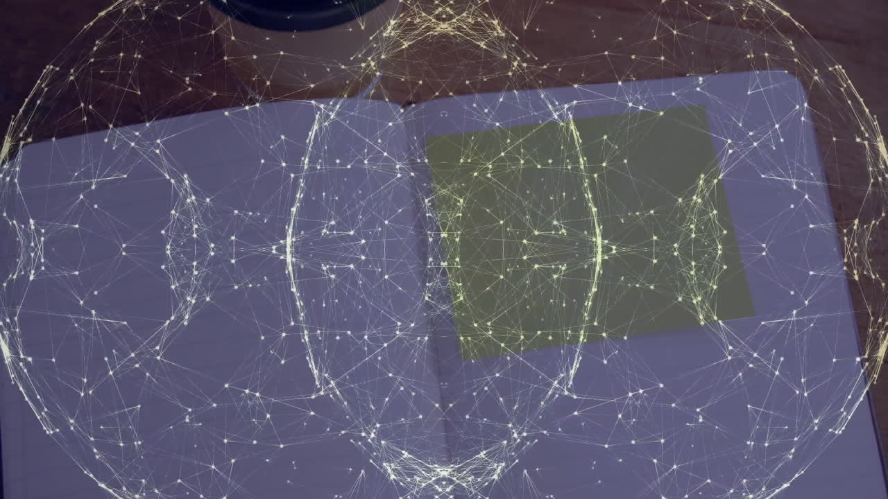 Digital network sphere floating above open notebook, showing sticky note and coffee cup