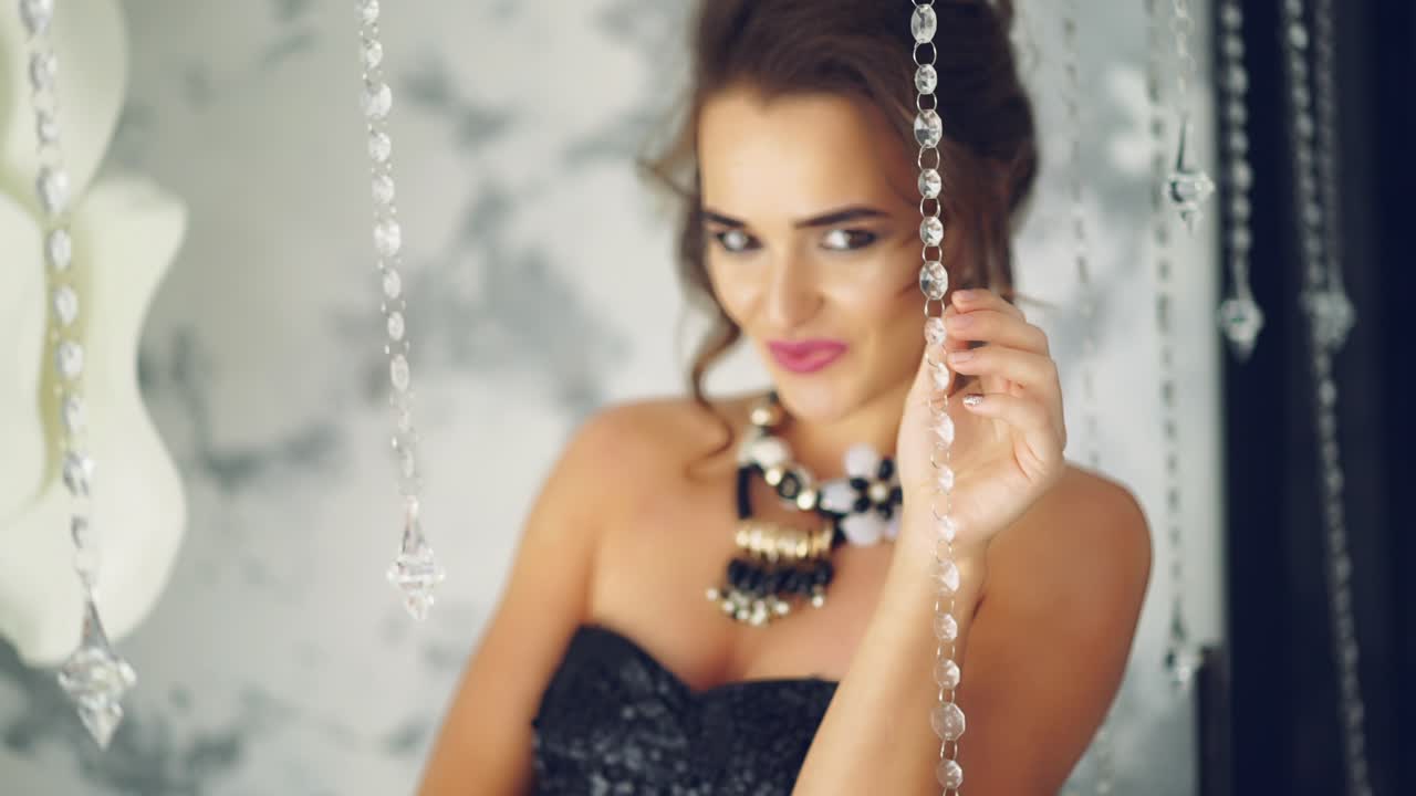 Woman in dress in luxurious interior. Stylish woman in dress in luxurious interior