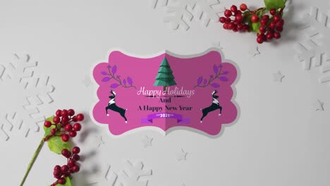 animation of happy holidays text over christmas decorations