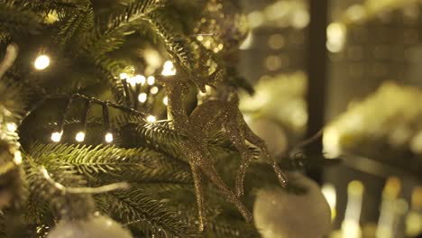 close-up view of a christmas tree with christmas decorations hanging