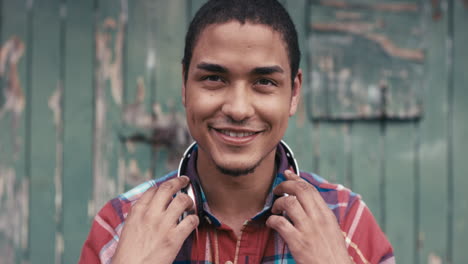 slow motion portrait of mixed race man listening to music