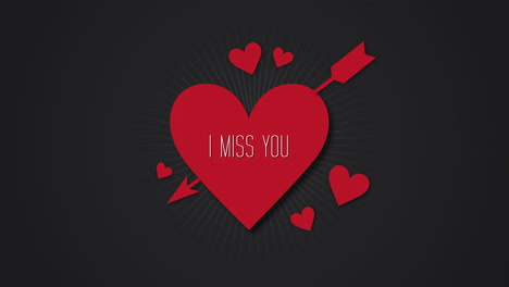 Animated-closeup-I-Miss-You-text-and-motion-romantic-big-red-heart-with-arrow-on-Valentines-day-background