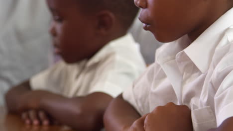 elementary school kids counting with blocks, close up