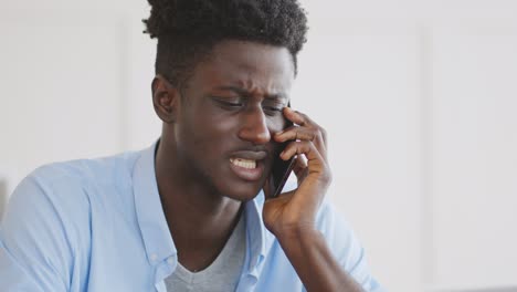 man arguing on phone