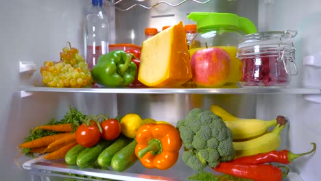 Open-refrigerator-filled-with-food