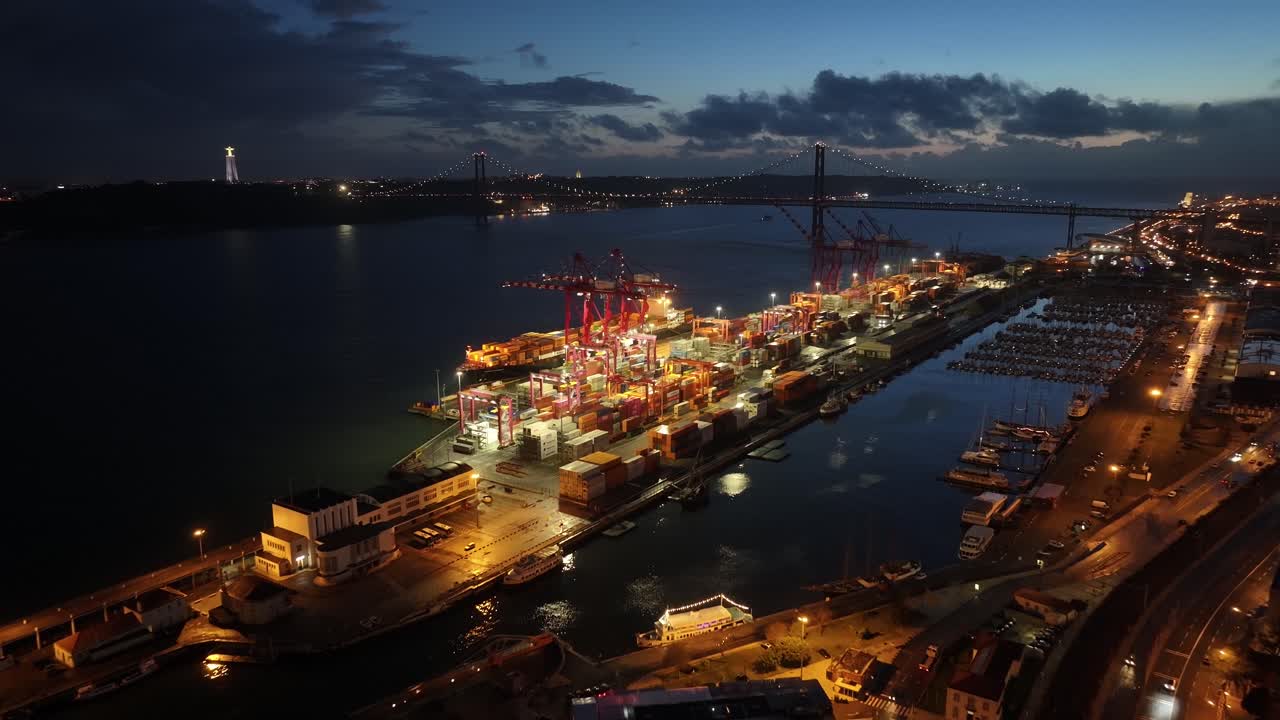 Night Scape Of Port Of Lisbon At Lisbon In District Of Lisbon Portugal. Illuminated City. Beautiful Cityscape. Port Of Lisbon At Portugal. Night City Landscape. Illuminated City
