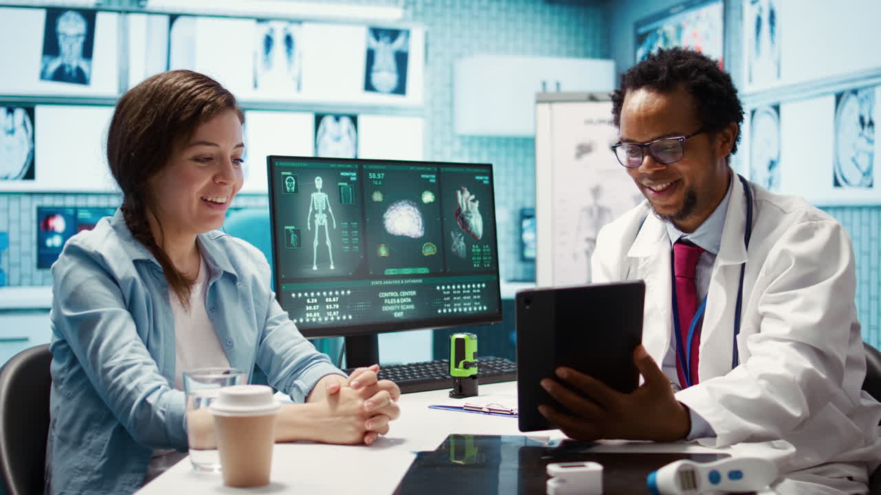 African american doctor presenting the x ray diagnostics on tablet