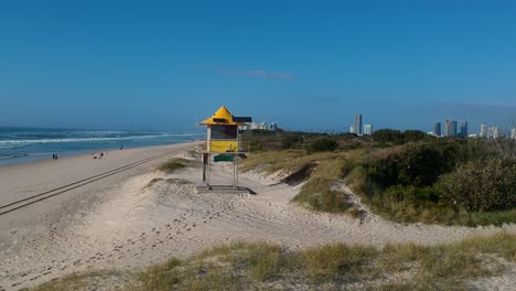 a surf lifesaving tower on a private beach close to a major city