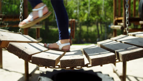 Schoolgirl-walking-on-playground-equipment