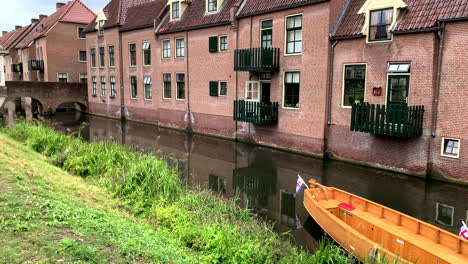 dutch gondola stands on the canal between the houses in zutphen netherlands