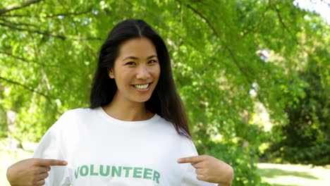 Pretty-volunteer-smiling-at-the-camera