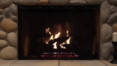 cozy stone fireplace with burning fire