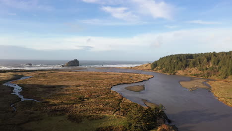 Aerial-rising-shot-over-Sixes-River-where-it-meets-Pacific-Ocean