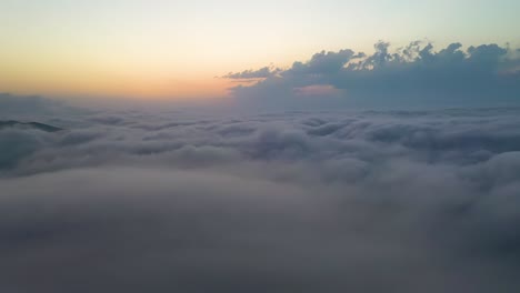 flying over the clouds with the late sun. sunrise or sunset colorful sky background.