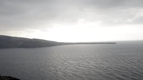 the wind blowing across the sea as it enters a caldera, taken from santorini, greece