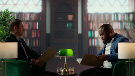 multicultural top secret agents in a bureau reading confidential documents