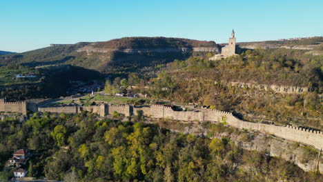 bulgaria’s tsarevets fortress on a clear day: cinematic aerial perspectives of a historic landmark