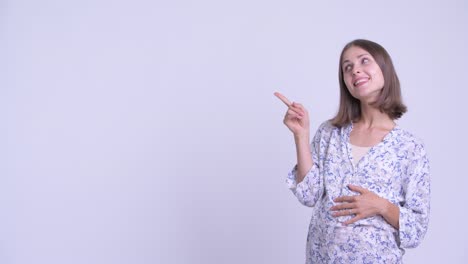 happy young beautiful pregnant woman with short hair