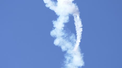 melissa burns in edge 540 stunt aircraft in flat spin with smoke trail