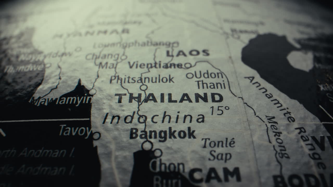 Close-up of a vintage world map highlighting Thailand