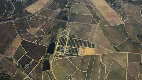 aerial shot of some beautiful green farmland and agriculture zones