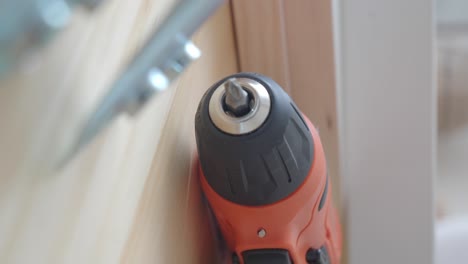 close-up of an electric screwdriver on wood