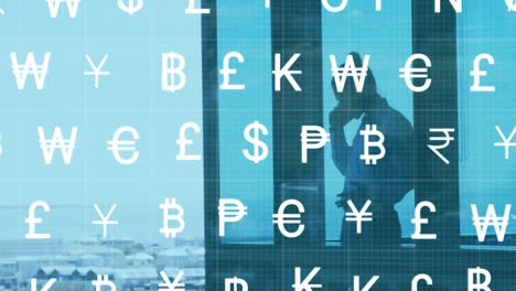 Animation-of-currency-symbols-over-asian-businessman-with-smartphone