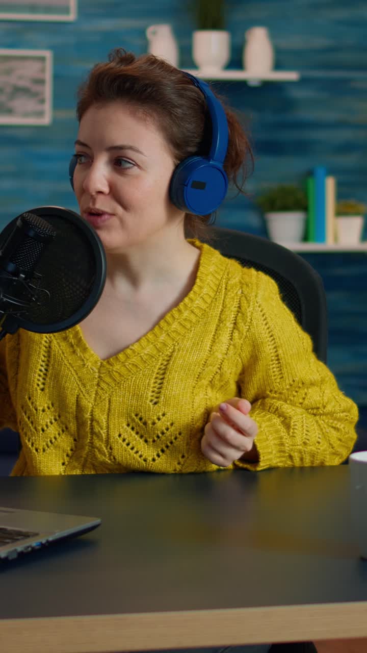 Vertical video: Vlogger looking at laptop and asking audience to subscribe