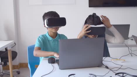 two classmates putting on vr goggles