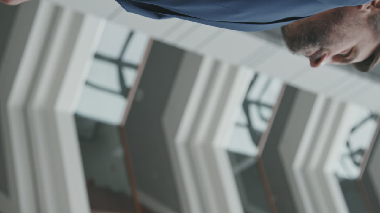 Vertical Close-Up of Businessmen Shaking Hands