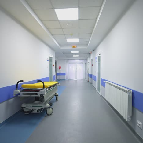 medical bed in the hospital corridor. interior of modern hospital with empty long corridor