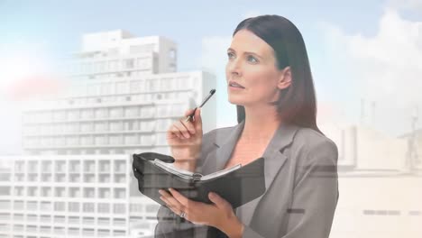 Animation-of-businesswoman-writing-over-cityscape