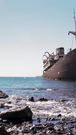 rusty shipwreck on the coastline