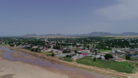 a drone shot of maroua town in cameroon with maroua river in view