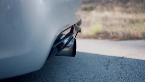 close-up of car exhaust pipe working