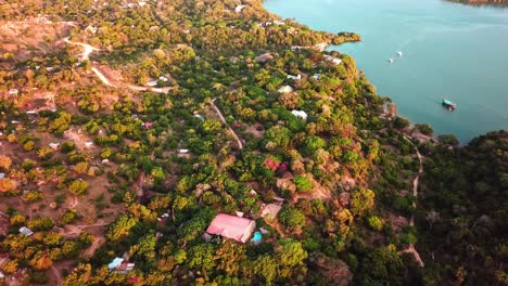 bird's eye view of kilifi bay surrounded with lush vegetation in kenya - aerial drone shot