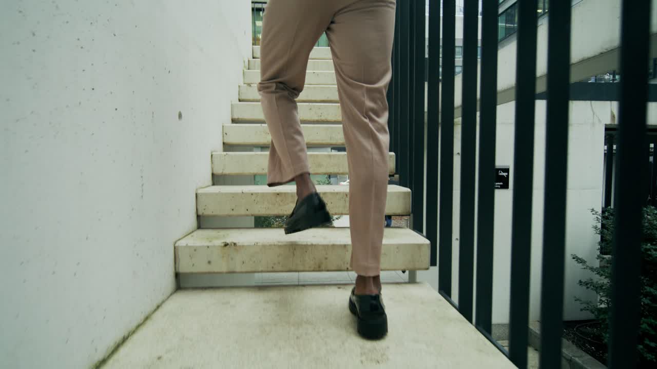 Person Walking Up Stairs in a City