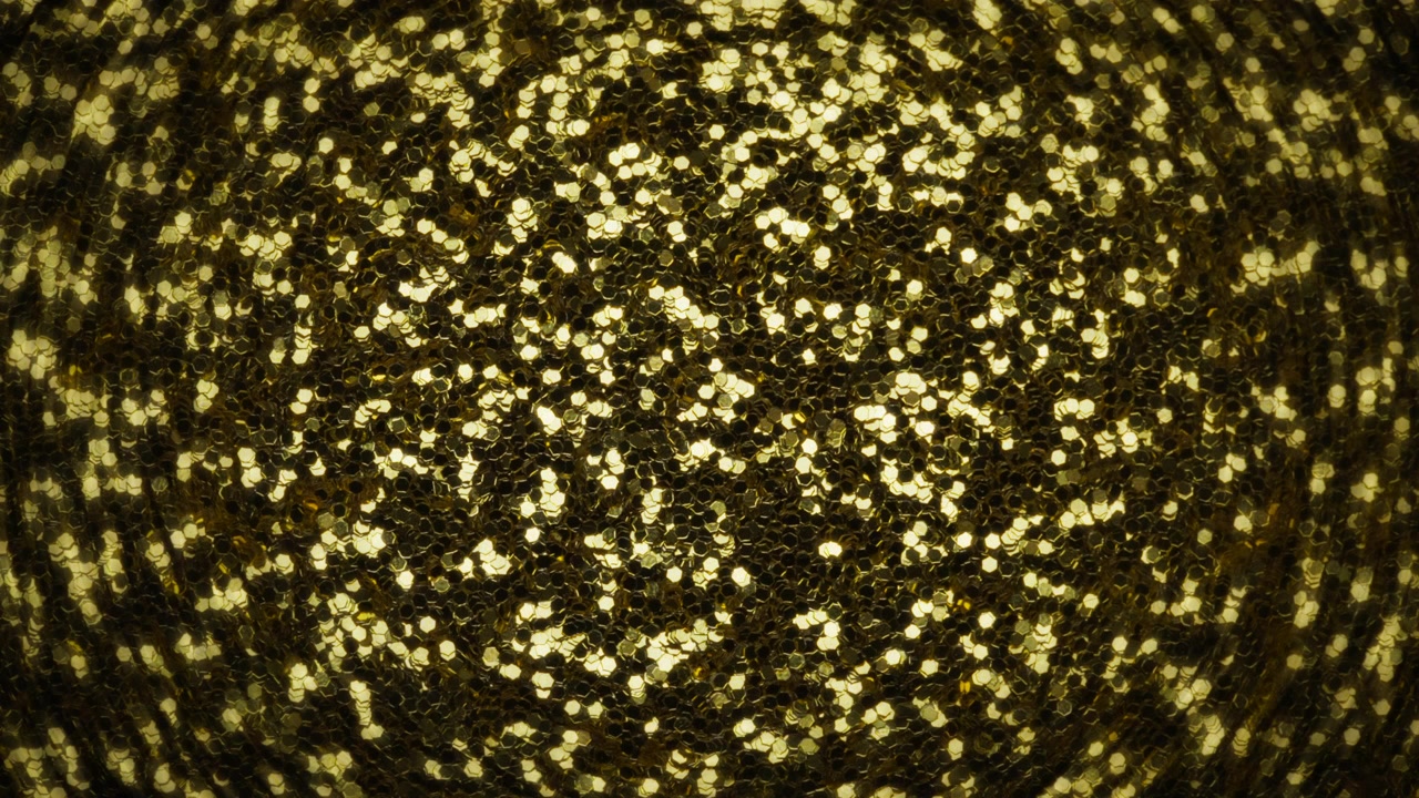 Light shining over golden glitter. Abstract background