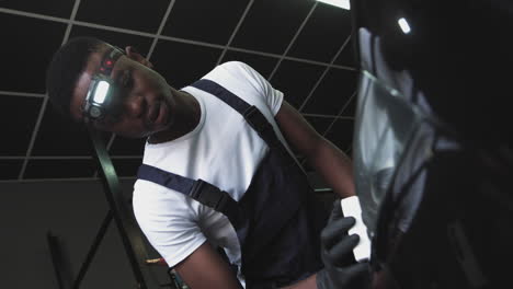 car detailer polishing a car